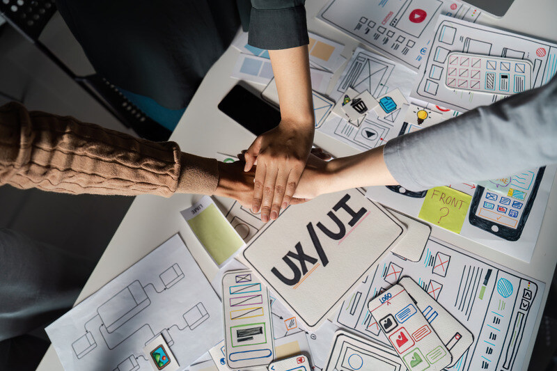 Team members collaborate on UI and UX goals 